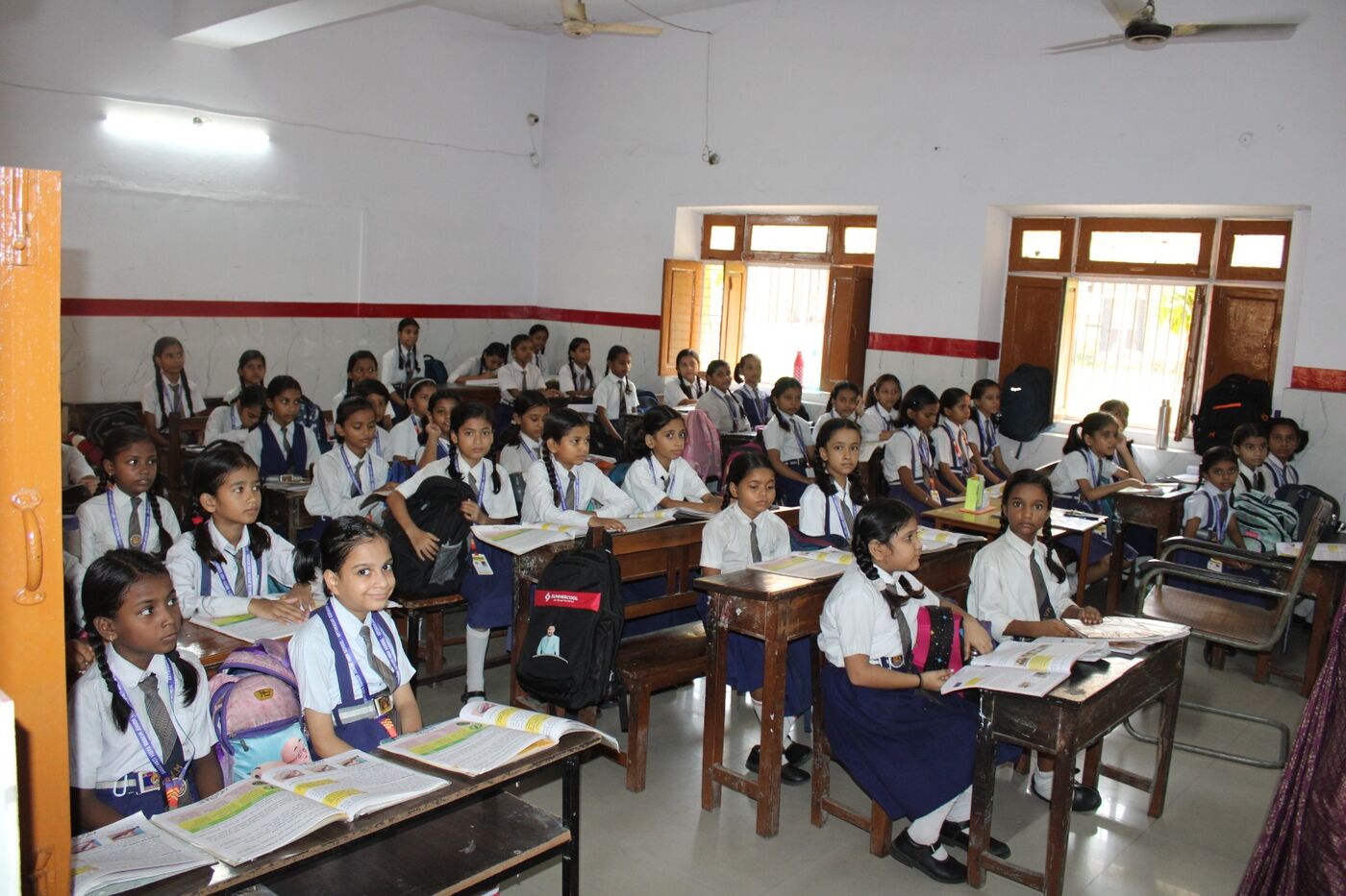 Classroom of girl students in uniform attending a lesson