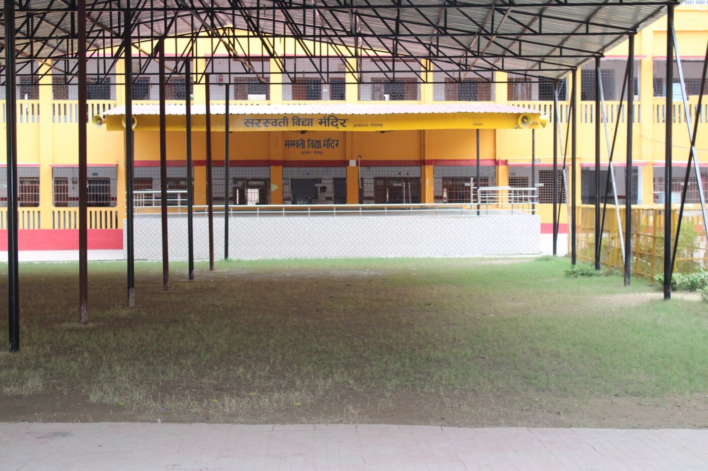 Covered open ground with a steel roof used for assembly and outdoor activities