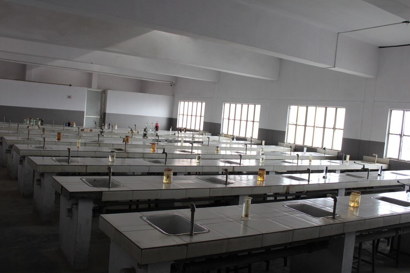Laboratory hall with rows of practical benches ready for a session