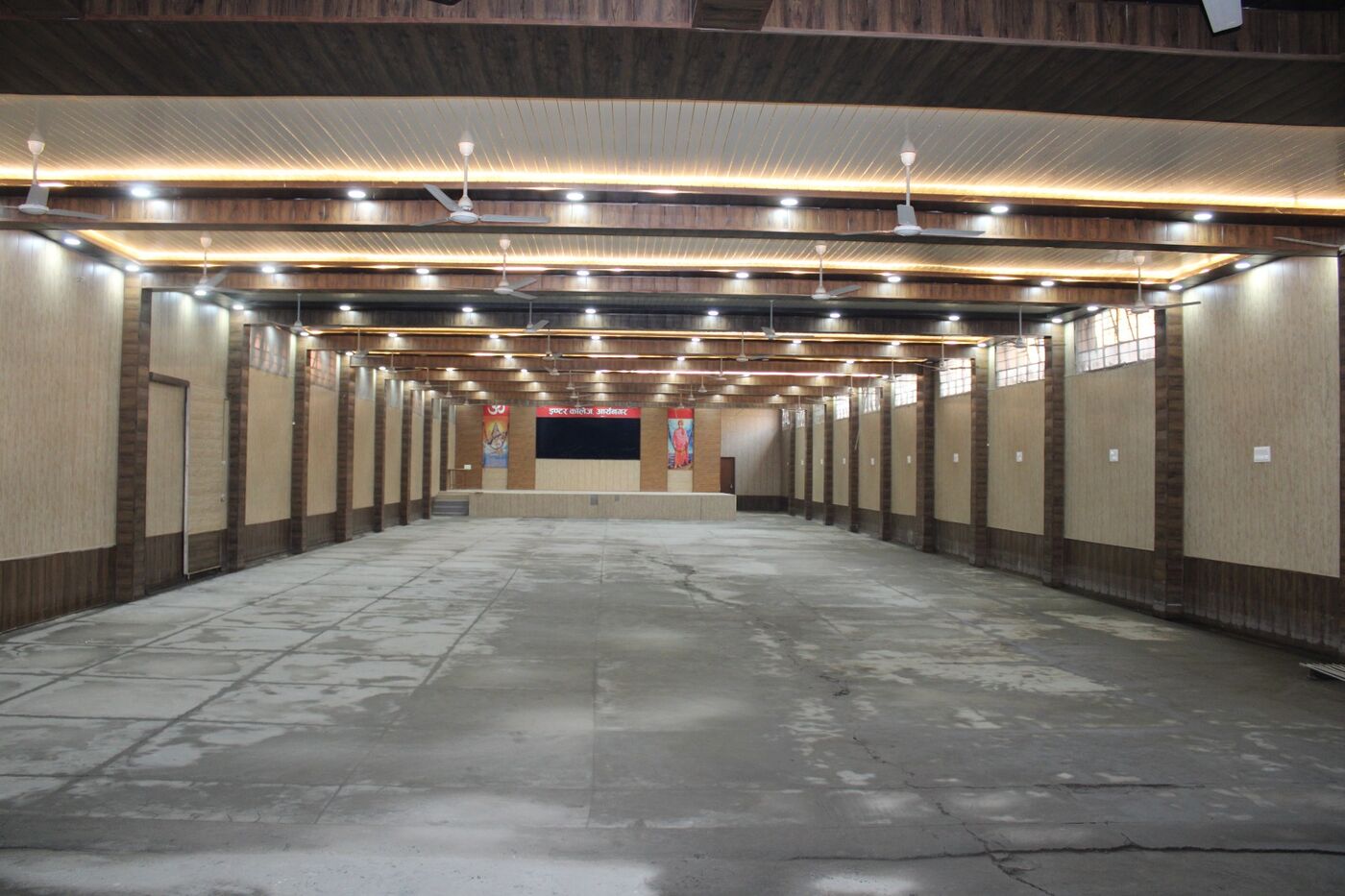 Long lighted hall used for college programmes and examinations