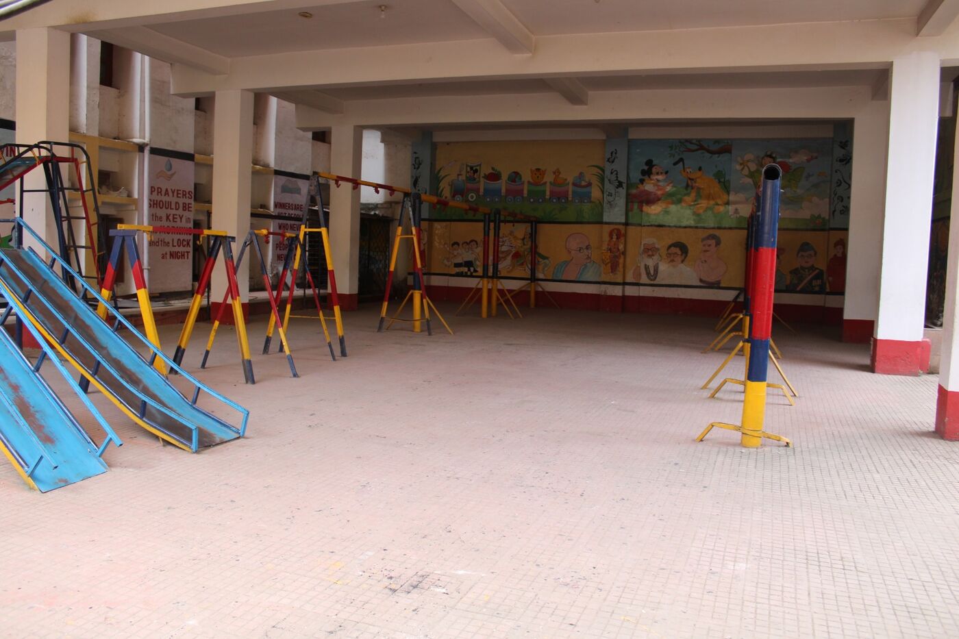 Sheltered play area with slides and climbing frames for the junior section