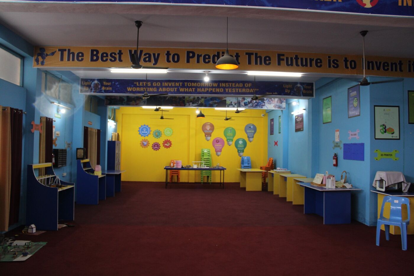 Activity room painted in blue and yellow with learning displays for junior students