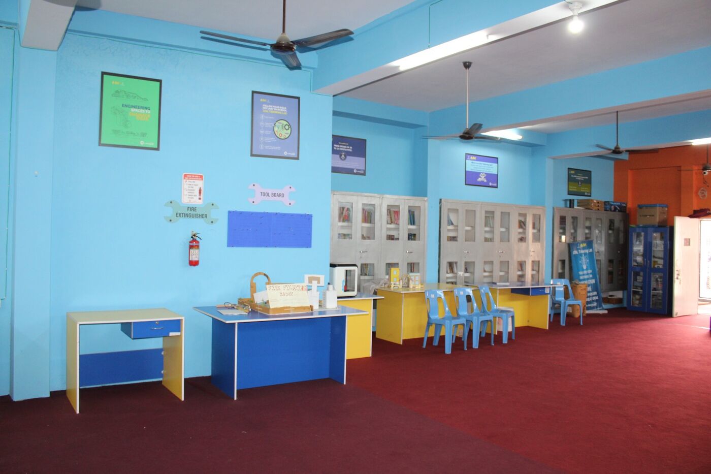 Atal Tinkering style innovation lab with equipment cabinets and work counters